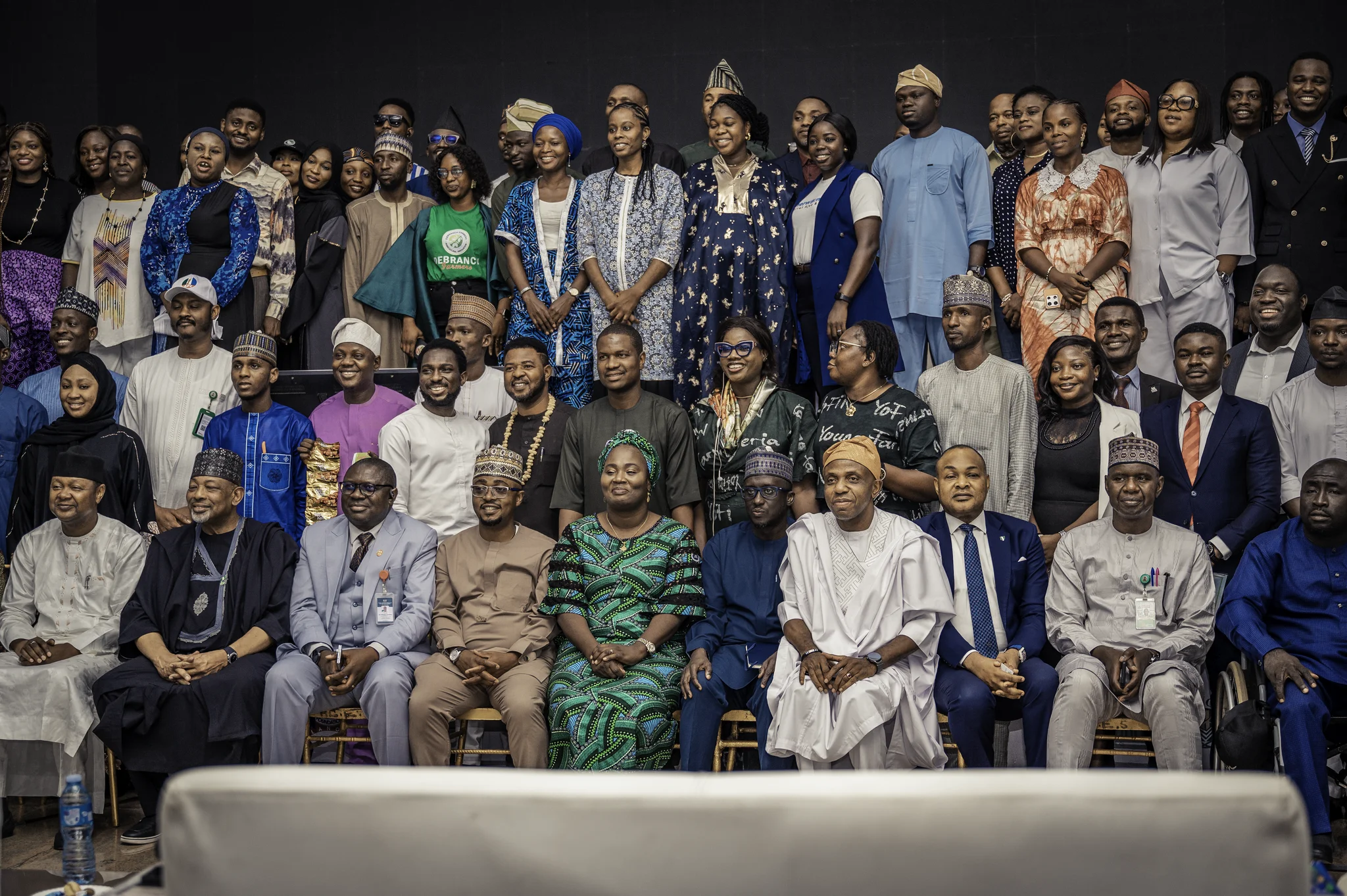 Large, official group photograph featuring Dr. Alabi alongside Minister Abubakar Kyari, key policy executives, and dozens of summit delegates.