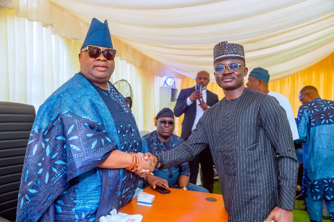 Dr. Alabi I. Oluwasegun shaking hands with the Executive Governor of Osun State, Ademola Adeleke, during a formal assembly.