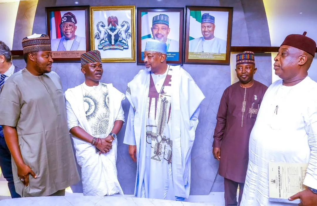 Dr. Alabi standing with Minister Abubakar Kyari and a delegation of policy executives at the Ministry of Agriculture.