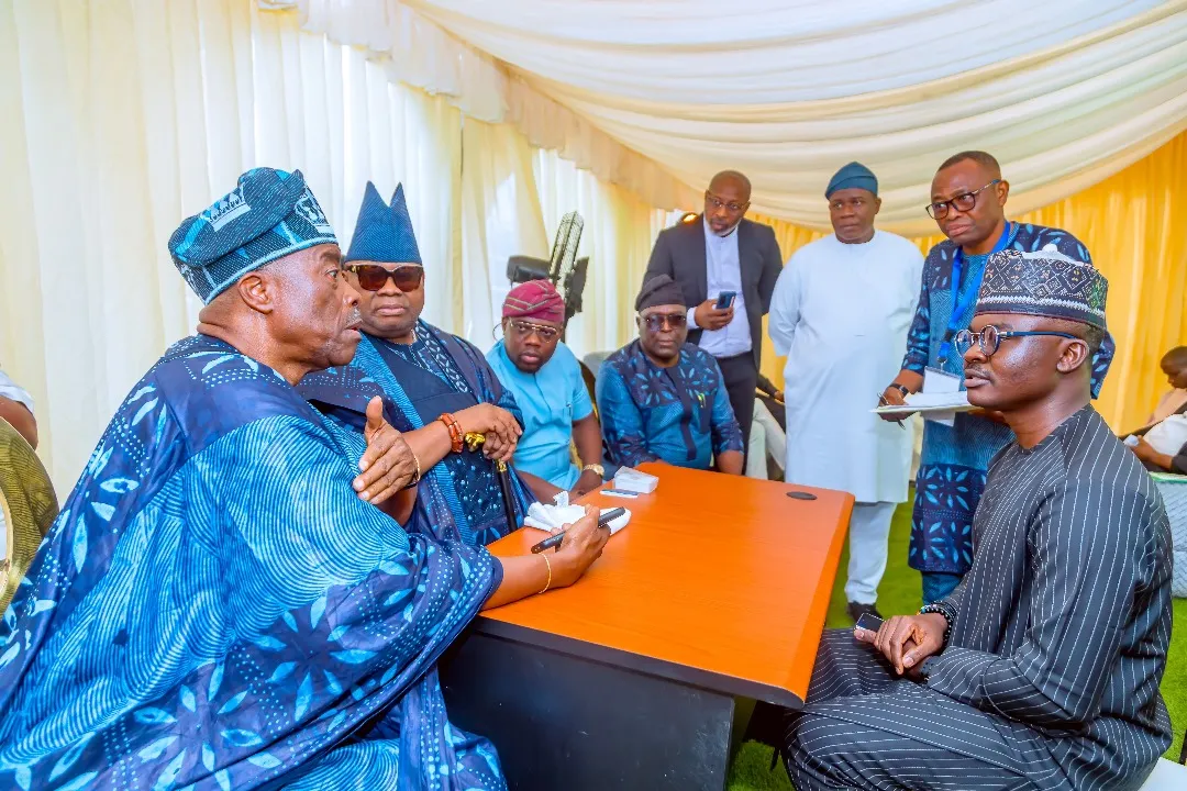 Dr. Alabi seated at a summit table, actively consulting with regional governors and traditional leaders.